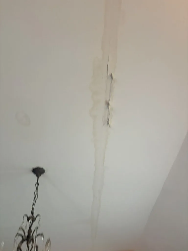 Roof leak water damage streak on ceiling before metal roof replacement, Fair Oaks Ranch TX