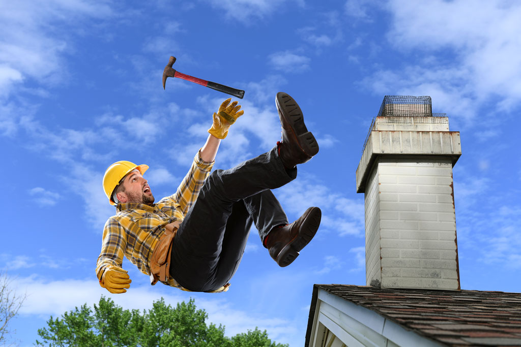 Image of man falling off a shingle roof